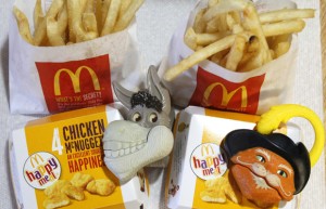 Two McDonald's Happy Meal with toy watches fashioned after the characters Donkey and Puss in Boots from the movie "Shrek Forever After" are pictured in Los Angeles